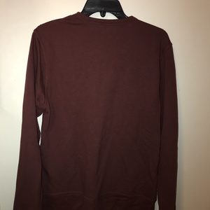 Women's maroon sun & moon design long sleeve sweater size small is being swapped online for free