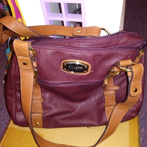 Rosetti Dark Burgundy Purse Handbag Faux Leather Multi Pockets Zippers is being swapped online for free