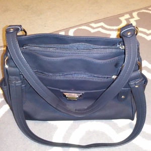 Rosetti Black Zipper Handbag Purse Faux Leather Lots of Pockets Used Once is being swapped online for free