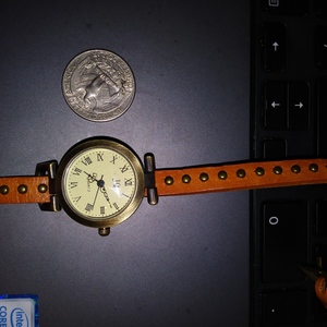 JQ Quartz Brass Wrap Around Watch Womens with Buckle Burnt Orange Adjustable is being swapped online for free
