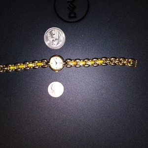 Gold Plated Citizen Elegance Womans Watch Yellowis stones in links Iredescent Face is being swapped online for free