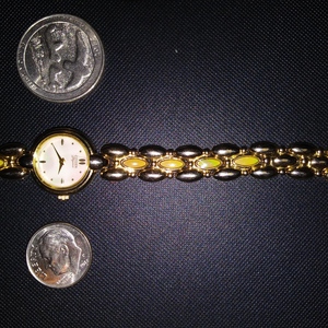 Gold Plated Citizen Elegance Womans Watch Yellowis stones in links Iredescent Face is being swapped online for free