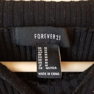 Formfitting Black Off The Shoulder Sweater is being swapped online for free