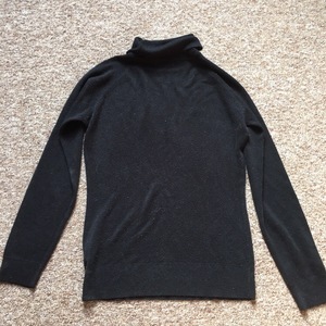 Black fitted turtle neck jumper is being swapped online for free