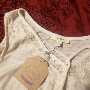 NWT cream cold shoulder medium blouse is being swapped online for free
