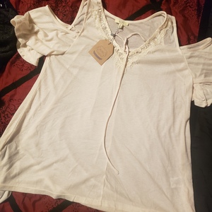 NWT cream cold shoulder medium blouse is being swapped online for free