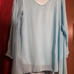 S-M NWOT blue blouse is being swapped online for free