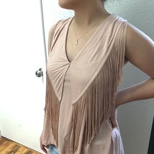 Pastel pink fringe sleeveless  is being swapped online for free