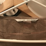 Peter Nygard tan long shrug  is being swapped online for free