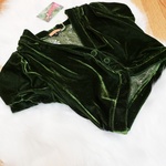 Parisian emerald green velvet shrug is being swapped online for free