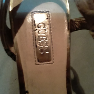 Gold sparkley Guess heels is being swapped online for free