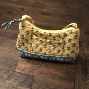 yellow Vera Bradley mini purse  is being swapped online for free