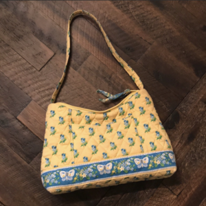 yellow Vera Bradley mini purse  is being swapped online for free