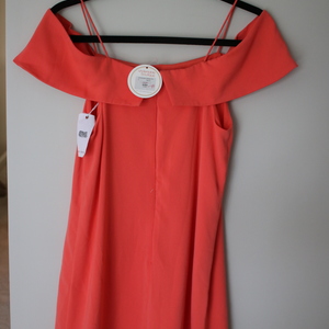 Undeniable Boutique Off-the-Shoulder Dress with Straps in Salmon is being swapped online for free