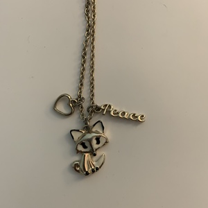Gold Necklace with Fox Heart and Peace Charms. is being swapped online for free