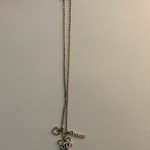 Gold Necklace with Fox Heart and Peace Charms. is being swapped online for free