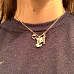 Gold Necklace with Fox Heart and Peace Charms. is being swapped online for free