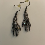 Silver Skeleton Hand Earrings is being swapped online for free