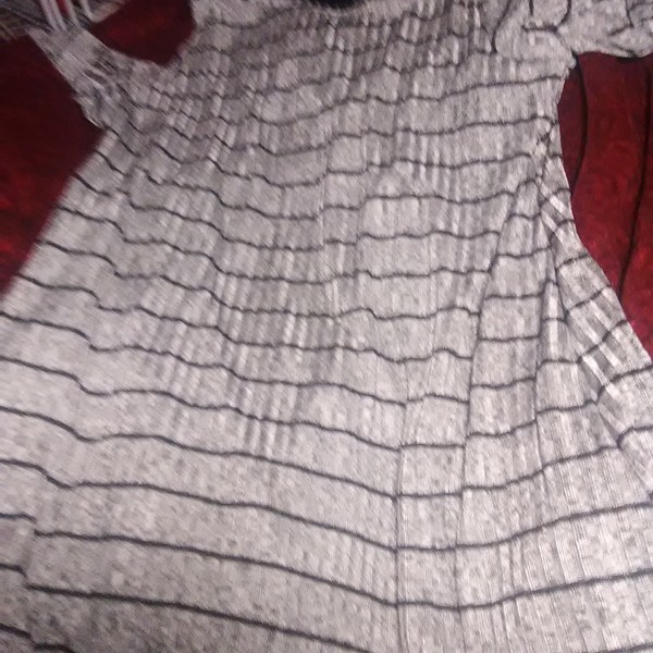 A d gray and black dress is being swapped online for free