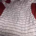 A d gray and black dress is being swapped online for free