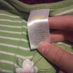 A green and white dress with a charry and a flower is being swapped online for free