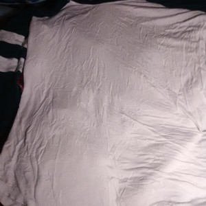 A white and dark blue half sleeve shirt is being swapped online for free