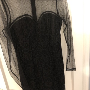 Bodycon black dress with mesh sleeves and sweetheart neckline  is being swapped online for free