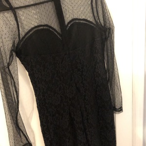 Bodycon black dress with mesh sleeves and sweetheart neckline  is being swapped online for free