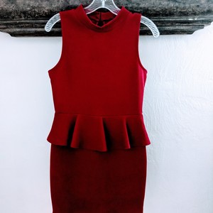 Short, red sleeveless fitted waist ruffle dress is being swapped online for free