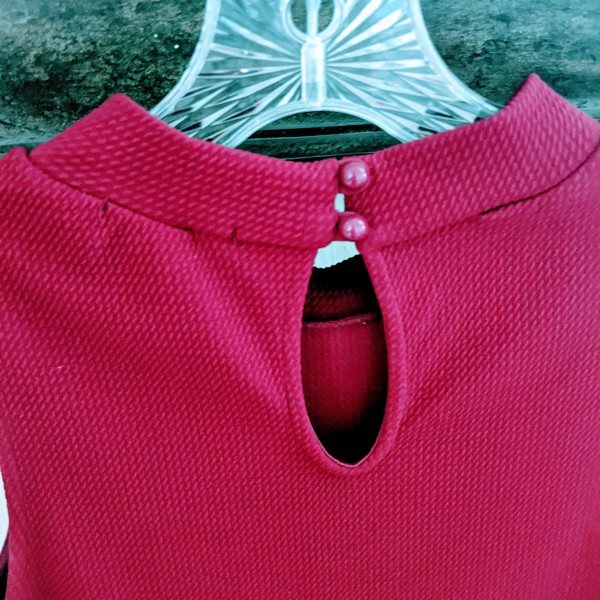 Short, red sleeveless fitted waist ruffle dress is being swapped online for free