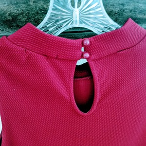 Short, red sleeveless fitted waist ruffle dress is being swapped online for free