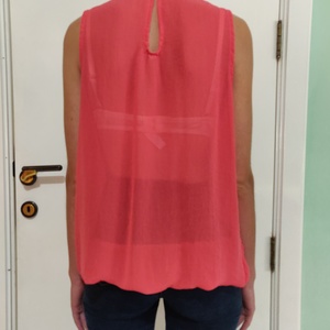Coral blouse with pearl beaded neck with keyhole in the back is being swapped online for free
