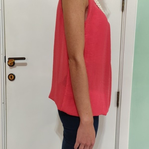 Coral blouse with pearl beaded neck with keyhole in the back is being swapped online for free