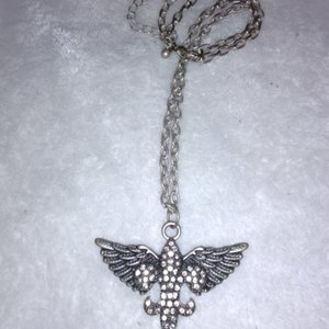 Winged Fleur de Lis Necklace is being swapped online for free
