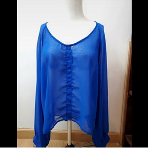 Brandy Melville Long Sleeve Cut Out Back Blouse is being swapped online for free