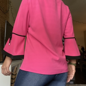 S Calvin Klein Pink VNeck Blouse is being swapped online for free