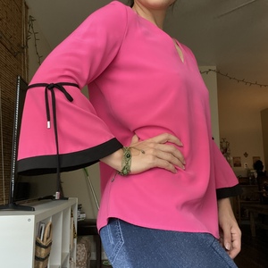 S Calvin Klein Pink VNeck Blouse is being swapped online for free