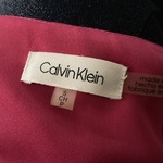S Calvin Klein Pink VNeck Blouse is being swapped online for free
