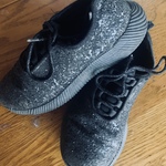 Sparkly black athletic shoes  is being swapped online for free