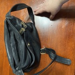 Useful black satchel purse by Tiganello is being swapped online for free