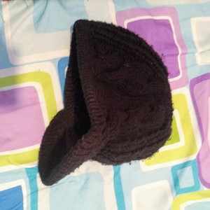 Black knitted newsboy cap is being swapped online for free