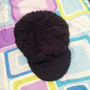 Black knitted newsboy cap is being swapped online for free