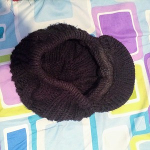 Black knitted newsboy cap is being swapped online for free