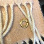 Pink Blush White Calvin Klein monogram scarf is being swapped online for free