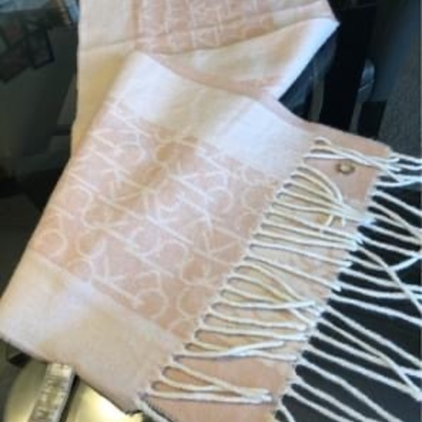 Pink Blush White Calvin Klein monogram scarf is being swapped online for free