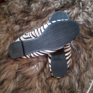 Brand new Michael kors slip on shoes in zebra  is being swapped online for free