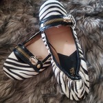Brand new Michael kors slip on shoes in zebra  is being swapped online for free