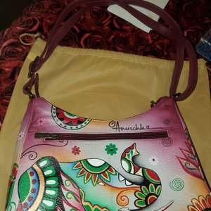 Brand new Anushka Hand Painted purse with dust bag  is being swapped online for free