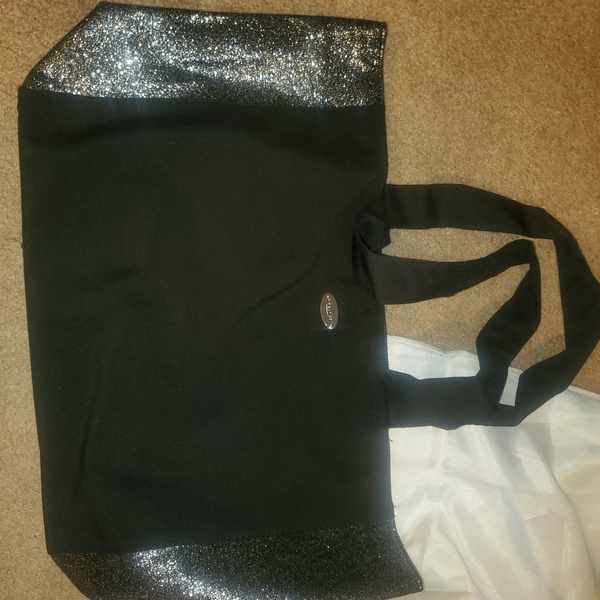 Brand new black and sparkle Coach tote bag is being swapped online for free
