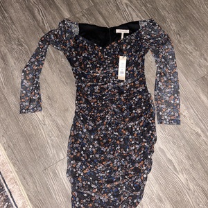 Long sleeve floral dress with sheer sleeves.   is being swapped online for free